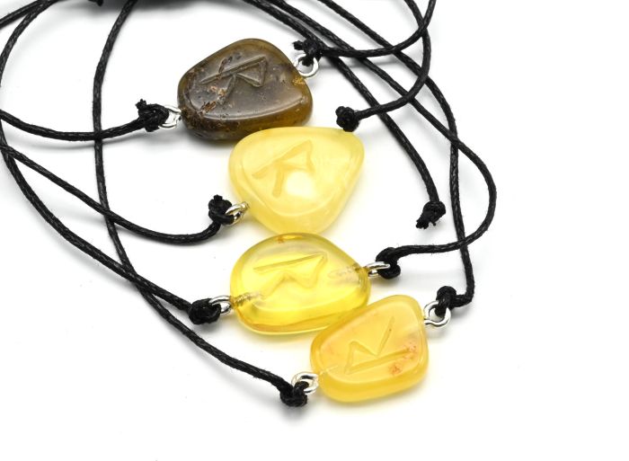 Bracelet with the Raido Rune made of amber 10*17mm on a lace color honey-milk