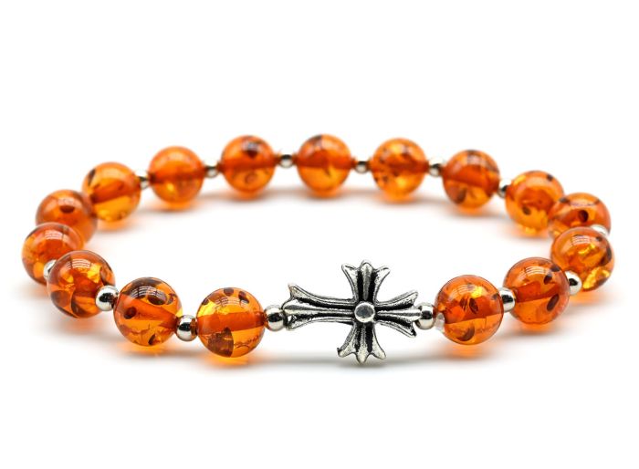 An 8mm amber bead bracelet with a cross color.cognac